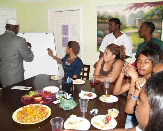 Professor teaching a group of students
